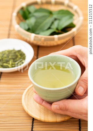 Green tea and tea leaves 111215512