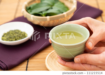 Green tea and tea leaves Green tea and tea leaves 111215514