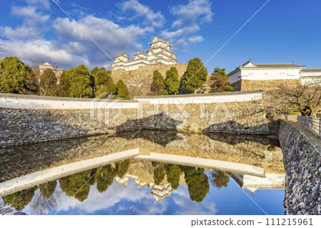 National treasure Himeji Castle at dusk, large castle tower and water mirror, Himeji City, Hyogo Prefecture 111215961