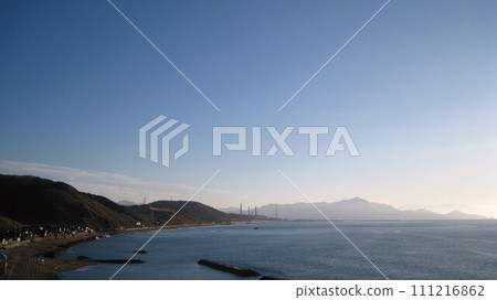 Looking down on the Sea of Japan from Cape Shiiya, the coastline of the cape, and Mt. Yoneyama in the back 111216862