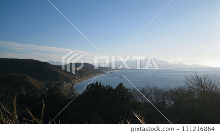 Looking down on the Sea of Japan from Cape Shiiya, the coastline of the cape, and Mt. Yoneyama in the back 111216864