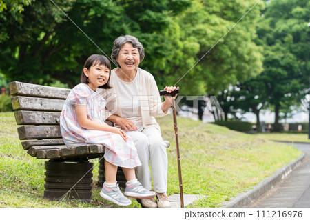 Senior playing with grandson 111216976