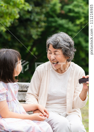 Senior playing with grandson Senior playing with grandson 111216985