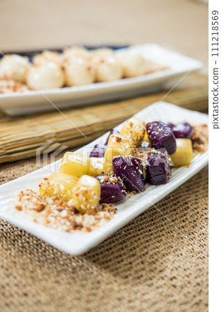 Taiwanese traditional sweet and dessert, glutinous rice dumplings and sweet potato dumplings with coconut sugar and peanuts and coconut flakes 111218569