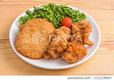 Assortment of croquettes and fried chicken 111219844