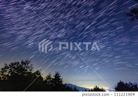 The starry sky and the lights of the Kofu Basin seen from Mt. Tennyo in the Yatsugatake Mountain Range 111221904
