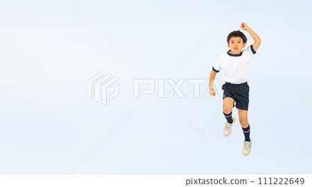 A boy wearing gym clothes jumping A boy wearing gym clothes jumping 111222649