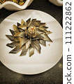 Smoked herring slices on a white plate in a restaurant 111222862
