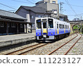 Train arriving at Mikuni Port Station and Meganebashi 111223127