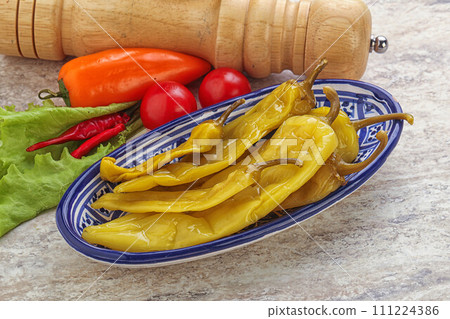 Pickled marinated spicy green pepper Pickled marinated spicy green pepper 111224386