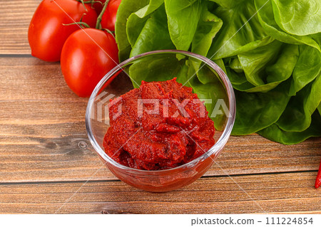 Tomato puree sauce for cooking 111224854