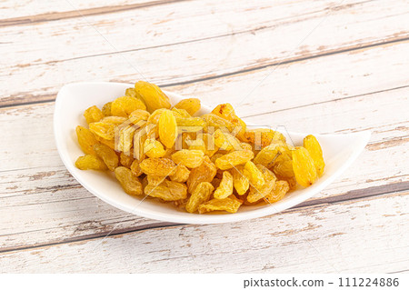 Yellow raisin - dry grape berries Yellow raisin - dry grape berries 111224886