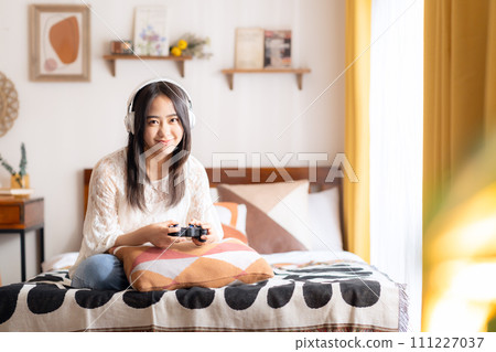 College woman playing games 111227037