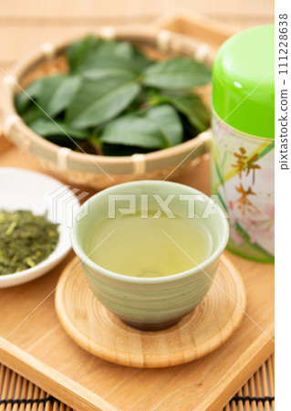 Green tea and tea leaves 111228638
