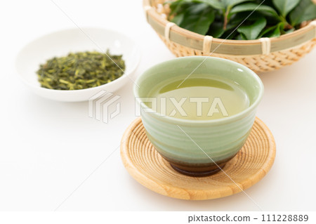 Green tea and tea leaves Green tea and tea leaves 111228889