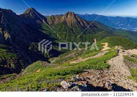 Mt. Akadake, Mt. Amida and the Southern Alps seen from Mt. Iodake in the Yatsugatake Mountain Range 111229414