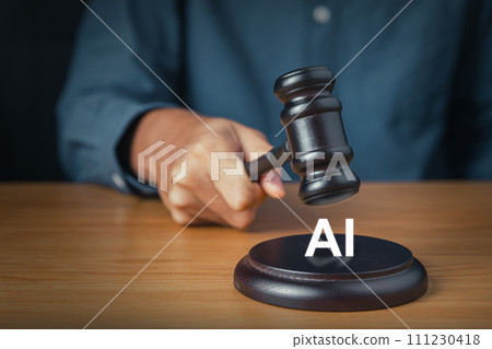 Man hand holding gavel with AI representing the legal debate on the prohibition and regulation of artificial intelligence 111230418