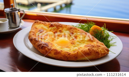 Mouthwatering cheese bread, a staple in Georgian cuisine with eggs Mouthwatering cheese bread, a staple in Georgian cuisine with eggs 111231614
