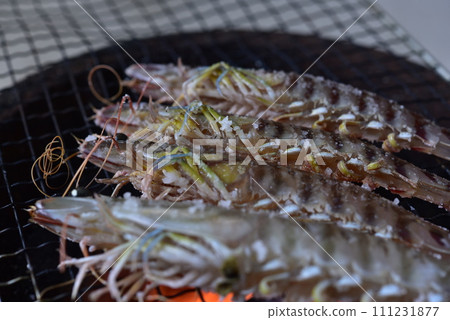 Prawns grilled on a charcoal grill Prawns grilled on a charcoal grill 111231877