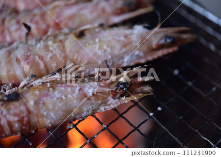 Prawns grilled on a charcoal grill Prawns grilled on a charcoal grill 111231900