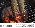Prawns grilled on a charcoal grill 111231905