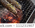Prawns grilled on a charcoal grill 111231907