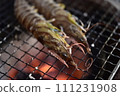 Prawns grilled on a charcoal grill 111231908