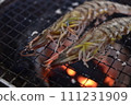 Prawns grilled on a charcoal grill 111231909