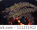 Prawns grilled on a charcoal grill 111231912