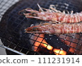 Prawns grilled on a charcoal grill 111231914