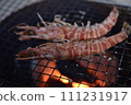 Prawns grilled on a charcoal grill 111231917
