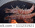 Prawns grilled on a charcoal grill 111231921