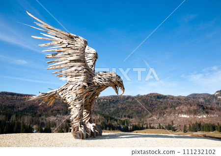 Wooden sculpture of an eagle. Italian landmark 111232102