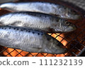 Sardines grilled on a charcoal grill 111232139