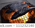 Sardines grilled on a charcoal grill 111232140