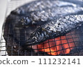 Sardines grilled on a charcoal grill 111232141