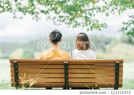 Couple pointing at the sky under the blue sky Couple pointing at the sky under the blue sky 111232471