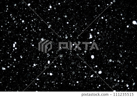 Snowfall on a black background. winter image. 111235515