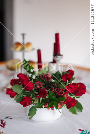 Bouquet of red roses with green leafs. Home mood at Woman's day 111235677