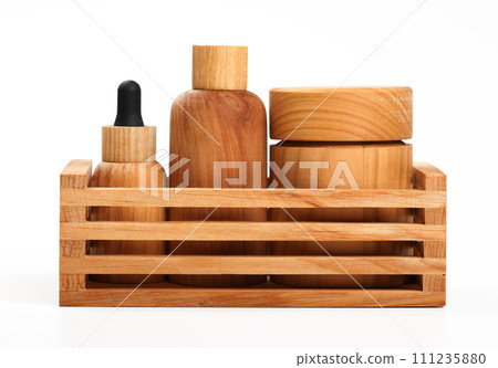 Hygiene toiletries in wooden organizer on white Hygiene toiletries in wooden organizer on white 111235880