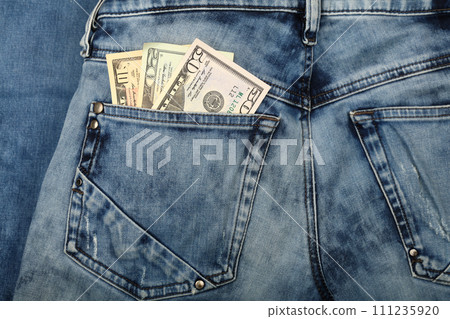 US dollar banknotes in jeans back pocket US dollar banknotes in jeans back pocket 111235920