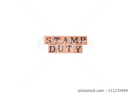 The inscription Stamp Duty made of wooden cubes on a plain background 111238494