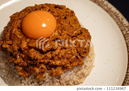 Keema curry topped with egg yolk Keema curry topped with egg yolk 111238967