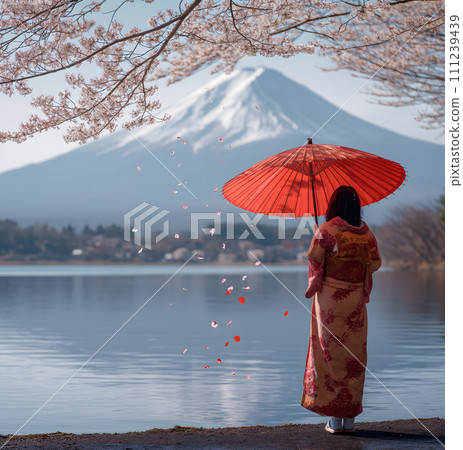 Woman wearing a kimono, holding a red umbrella, stands in front of Mount Fuji. By the lake, 111239439