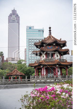 Traditional Chinese architecture buildings in city park with modern buildings in background, Taiwan 111239876
