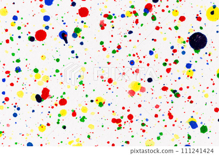 Paint splatters on bright material. Watercolor on white paper. Paint splatters on bright material. Watercolor on white paper. 111241424