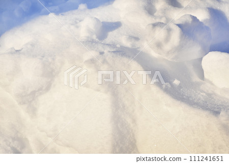 Lumps of snow in winter. Snow and light during the day. Snowdrifts. Lumps of snow in winter. Snow and light during the day. Snowdrifts. 111241651
