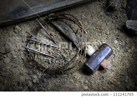Rusty nails and a wreath of thorns at the cross 111241705