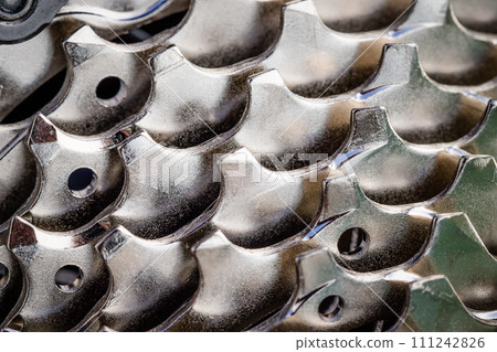 New bicycle silver color chain, full frame, abstract shiny background New bicycle silver color chain, full frame, abstract shiny background 111242826