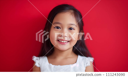 Young Asian girl on red background. Young Asian girl on red background. 111243090